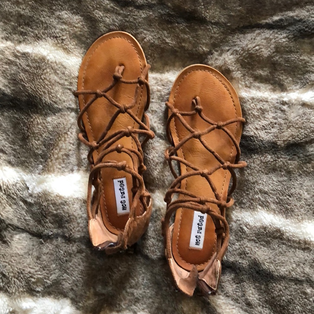 Not Rated, tan gladiators.